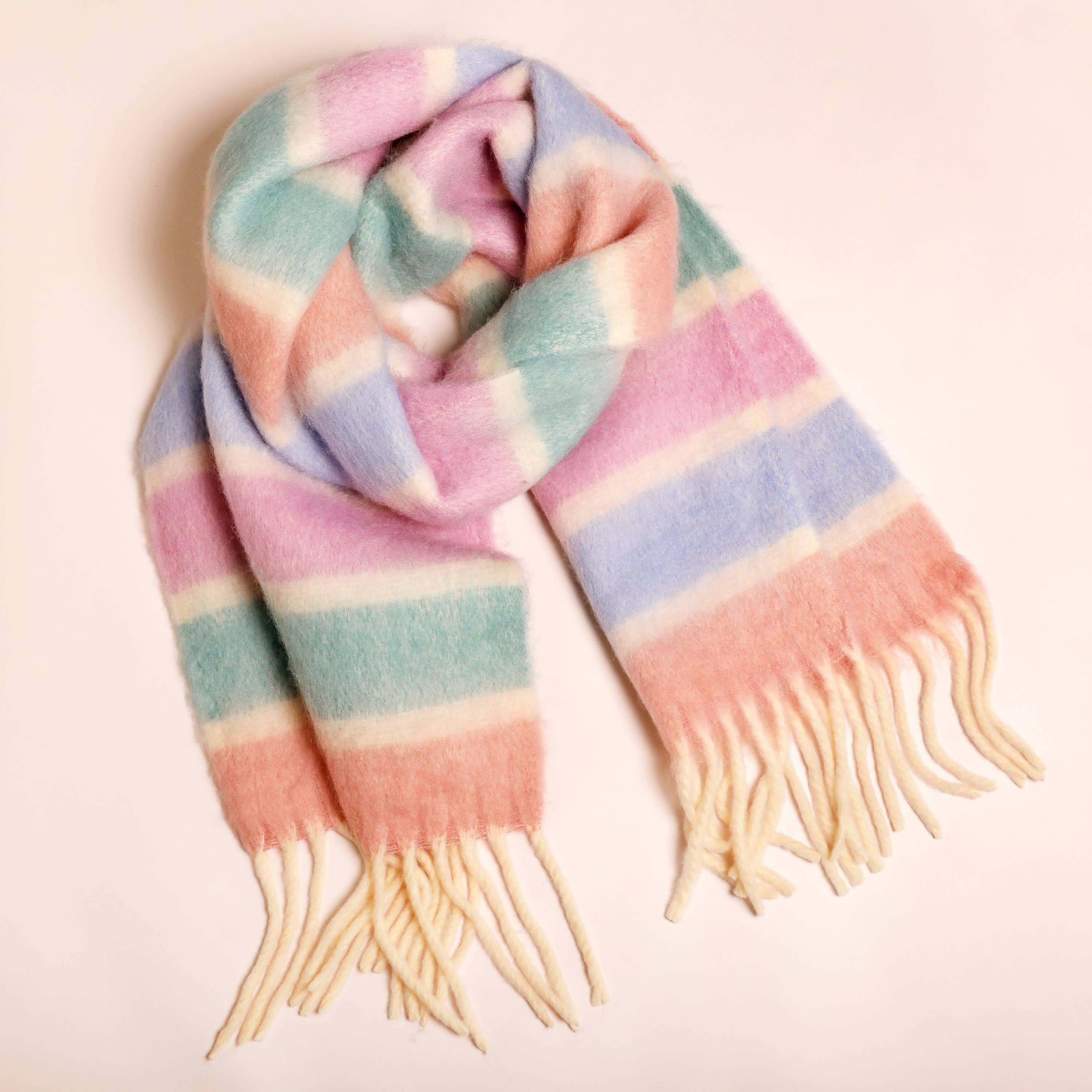 Pastel and cream colored striped scarf with fringes