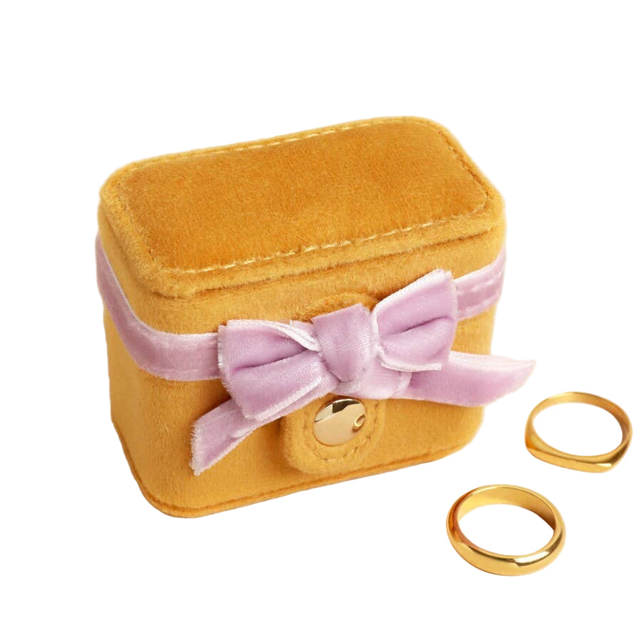 Mustard Velvet Ring Box jewelry box with a purple bow and gold rings 