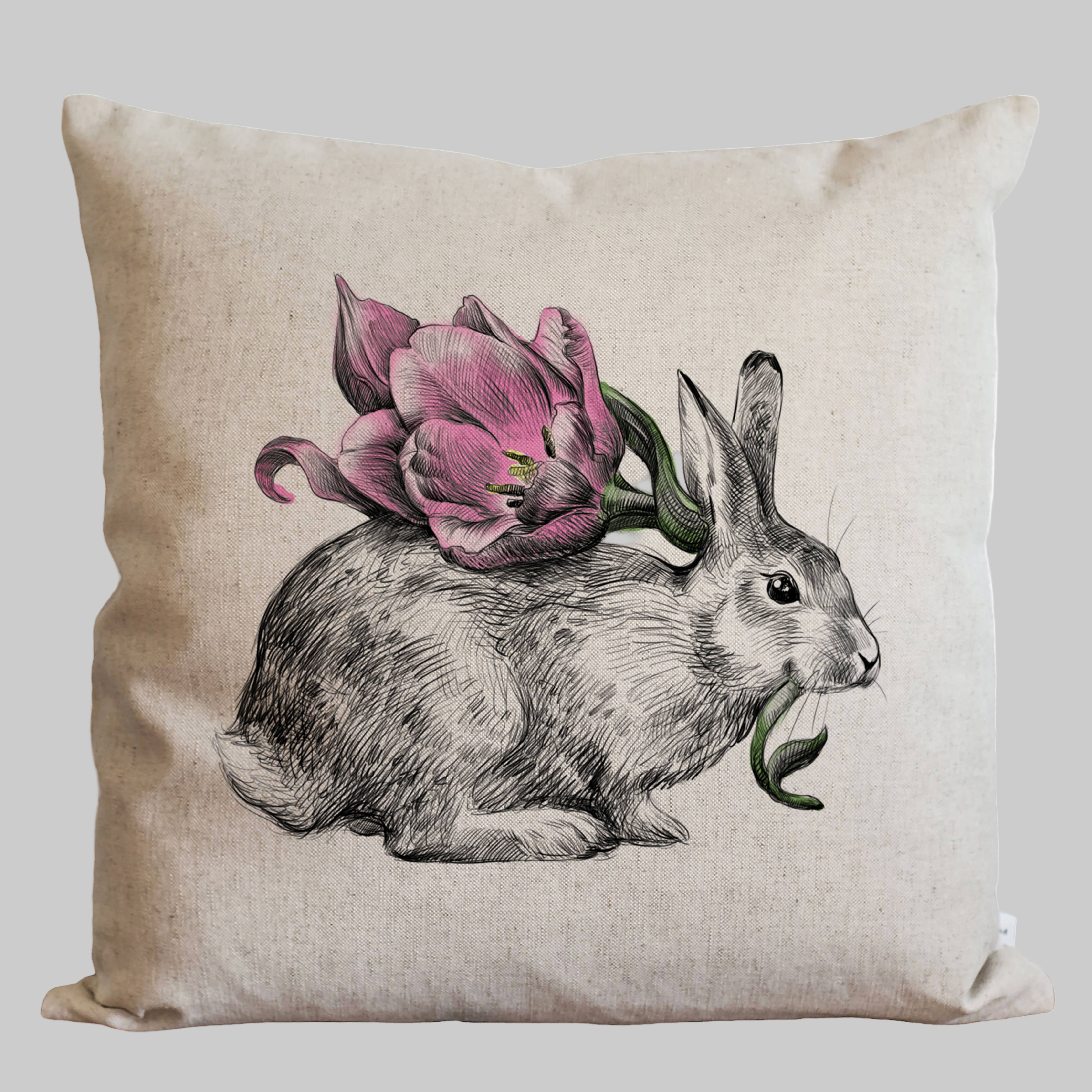 Decorative pillow with a rabbit and pink purple tulip design